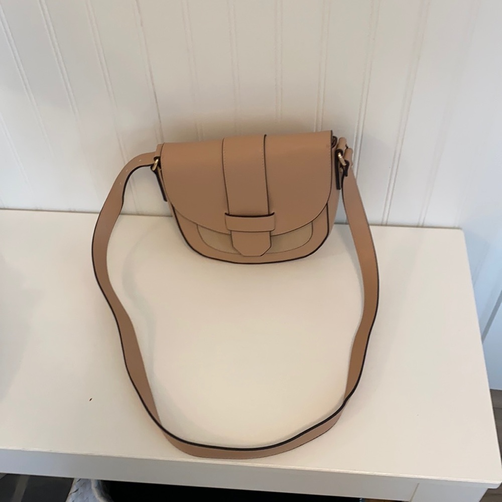 A new day blush colored saddle bag